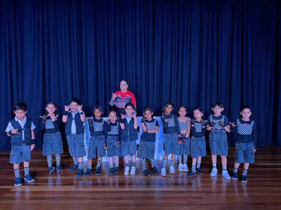 Junior group performing with their teacher
